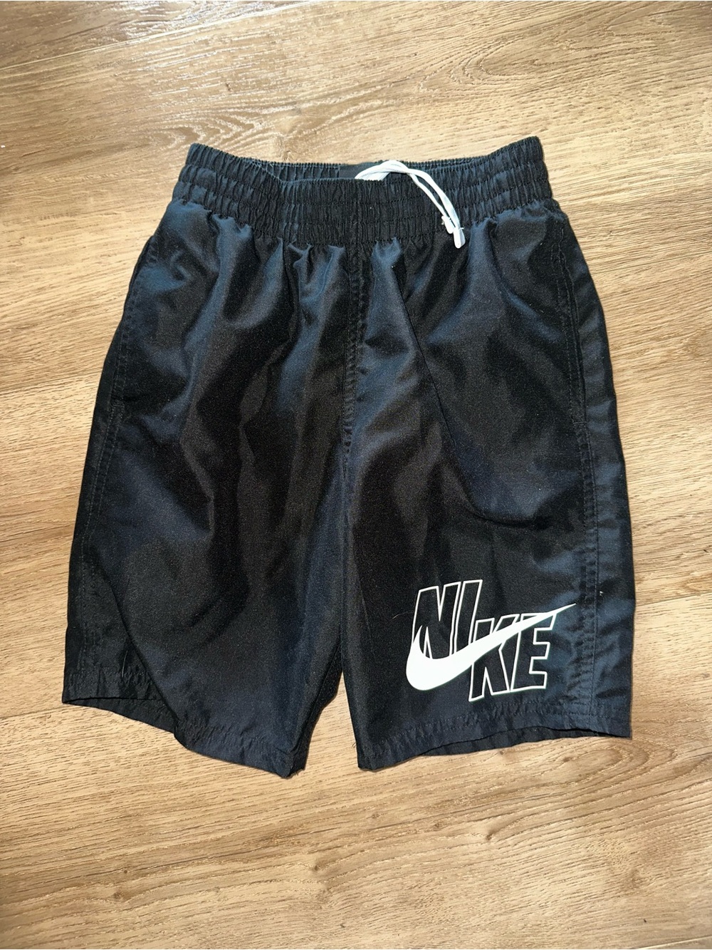 Nike Black Kids Swim Trunks with White Swoosh Logo